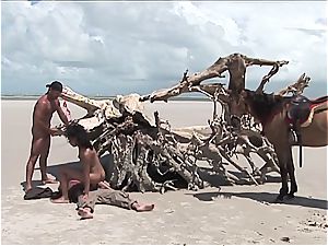 horny mexican chick gets two stiffys on the beach